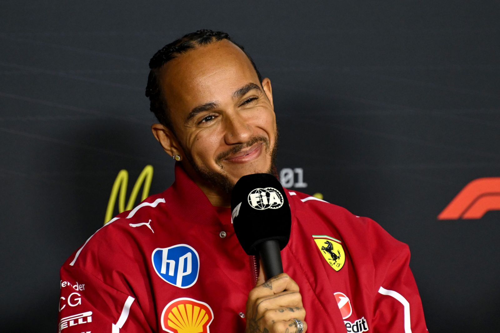 MELBOURNE, AUSTRALIA - MARCH 13: Lewis Hamilton of Great Britain and Scuderia Ferrari in the Press Conference during previews ahead of the F1 Grand Prix of Australia at Albert Park Grand Prix Circuit on March 13, 2025 in Melbourne, Australia. (Photo by Mark Sutton - Formula 1/Formula 1 via Getty Images)