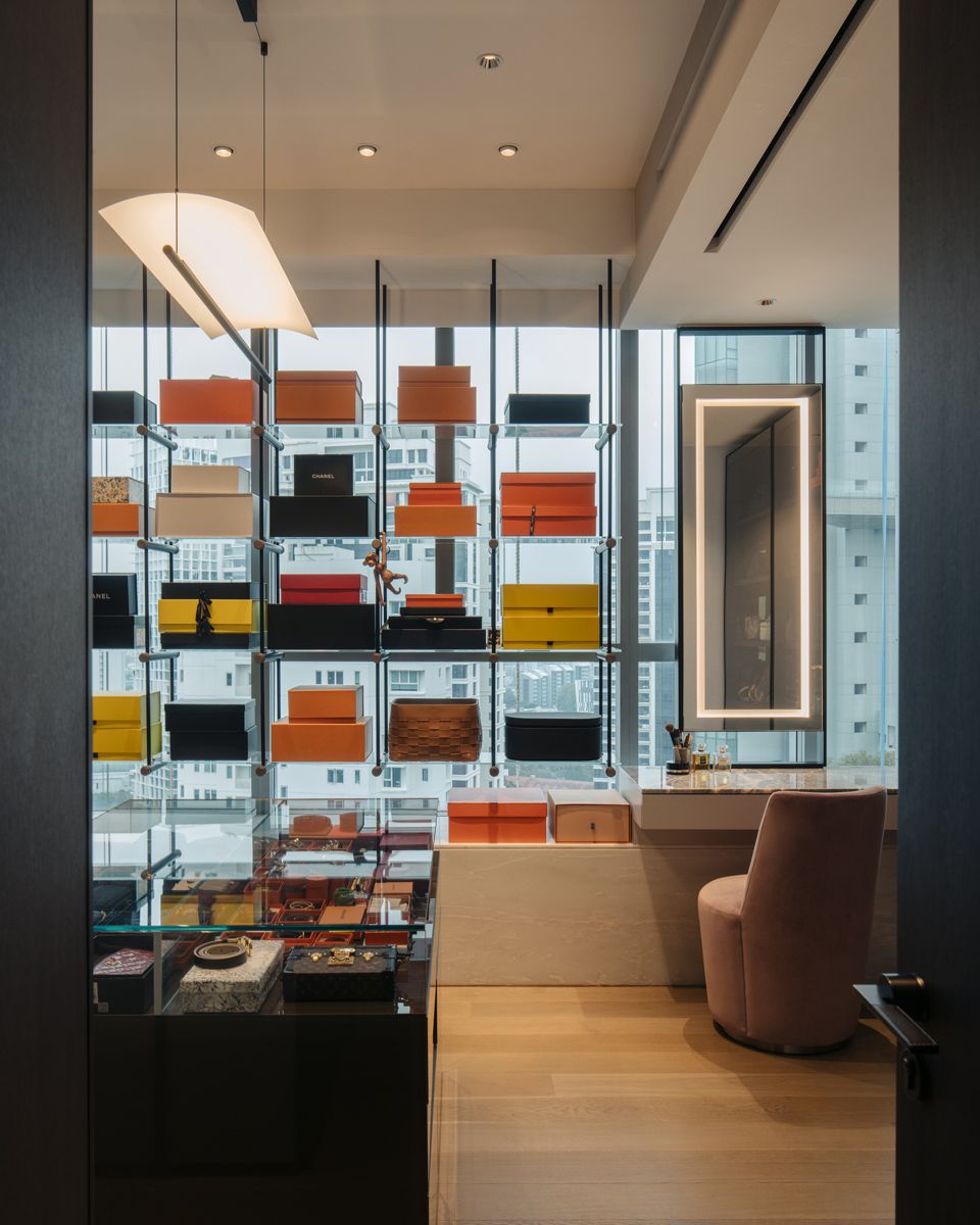 The wife's impeccably-lit walk-in wardrobe artfully displays her bag collection