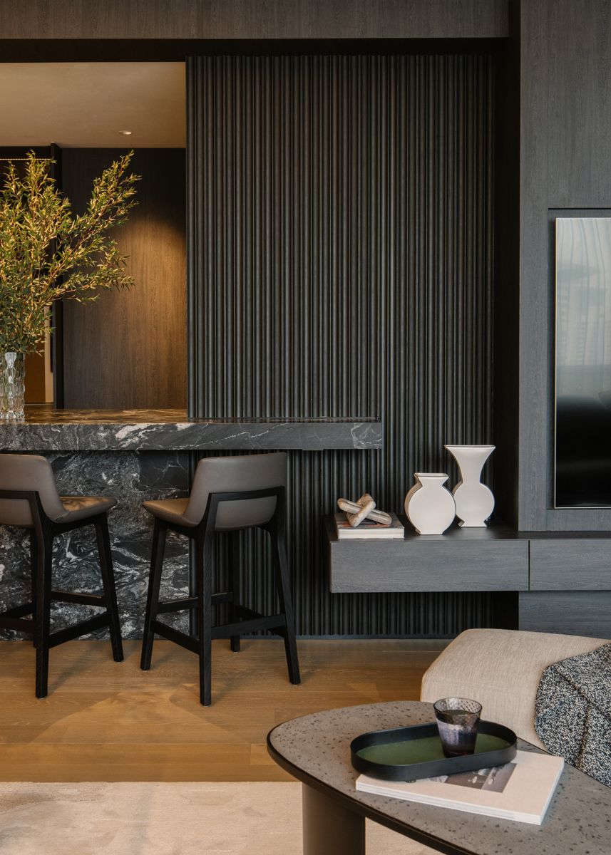Fluted articulation at the household shelter wall creates visual interest