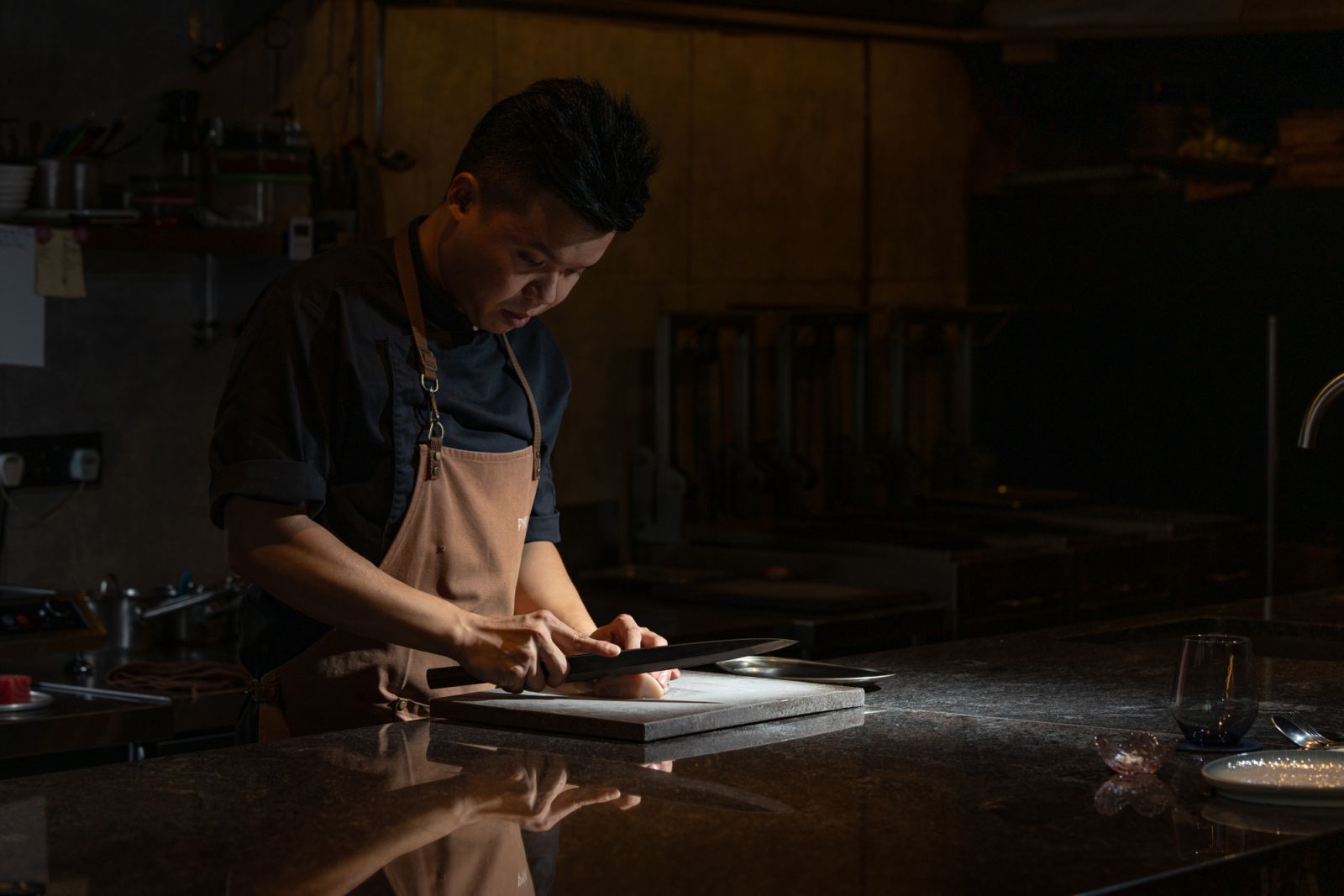 Chef Louis in his element, crafting every dish with precision at Pyro