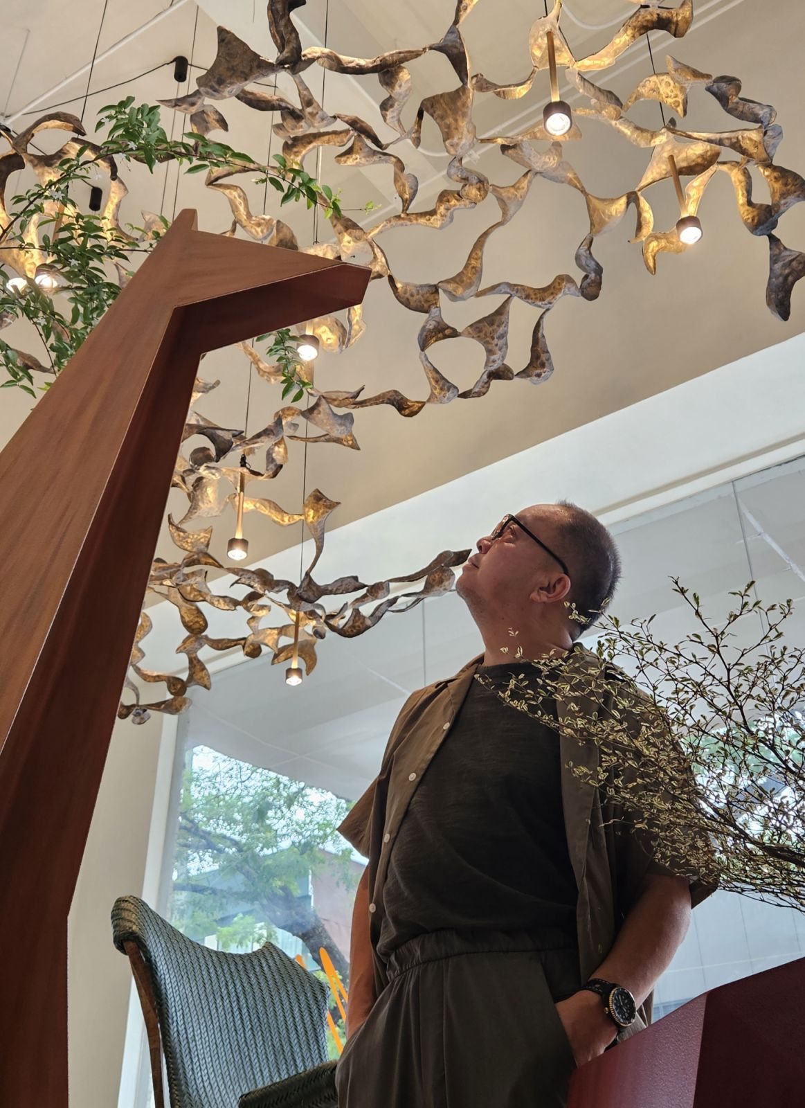 Jude Tiotuico of Industria Gallery examining his creations