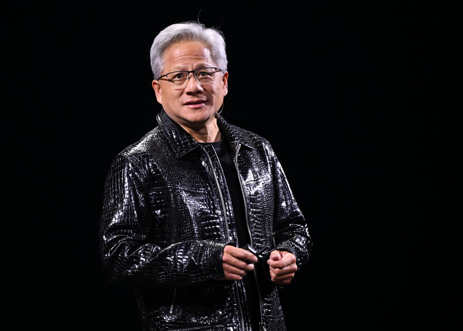 LAS VEGAS, USA - JANUARY 06:
Nvidia CEO Jensen Huang addresses participants at the keynote of CES 2025 in Las Vegas, Nevada, on January 6, 2025. During the presentation, Huang unveiled a range of new chips, software, and services, reinforcing Nvidia's leadership in artificial intelligence computing and its continued innovation across industries. (Photo by Artur Widak/NurPhoto via Getty Images)