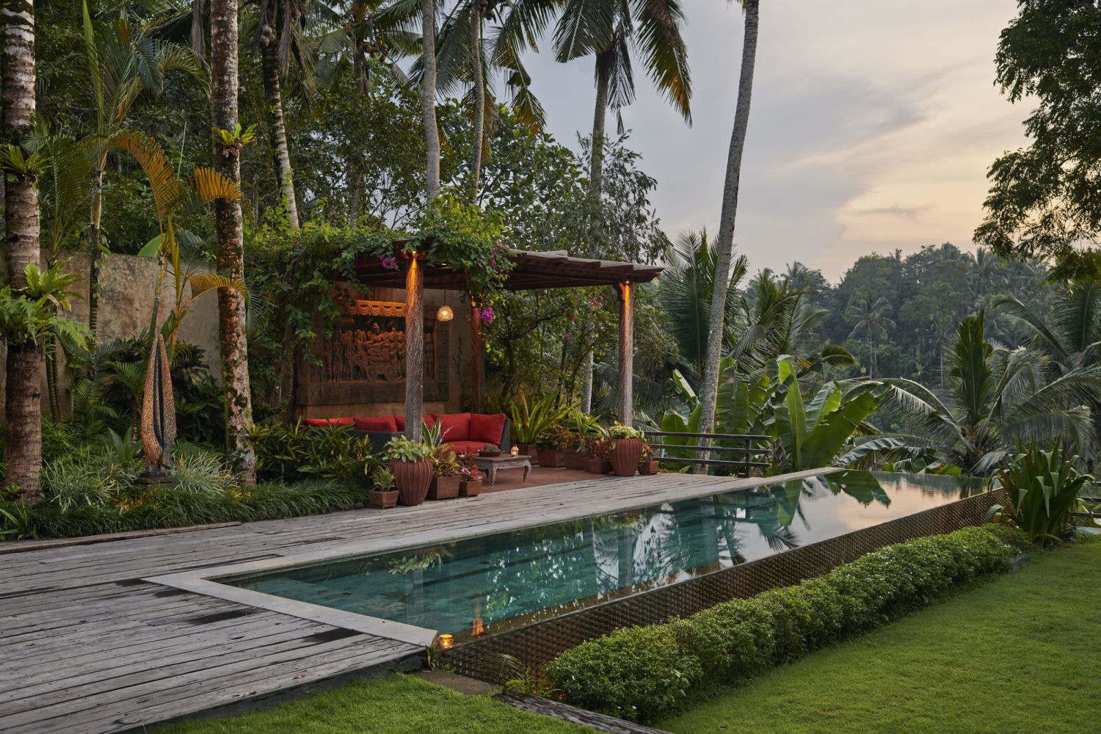 garden and pool area of private villa, resort situated in Ubud with valley view at dawn, sunrise