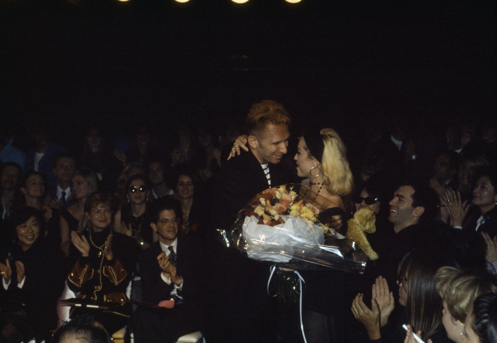 French fashion designer Jean-Paul Gaultier offering a bouquet of flowers to Madonna during 1991 Spring-Summer fashion show. (Photo by Pierre Vauthey/Sygma/Sygma via Getty Images)