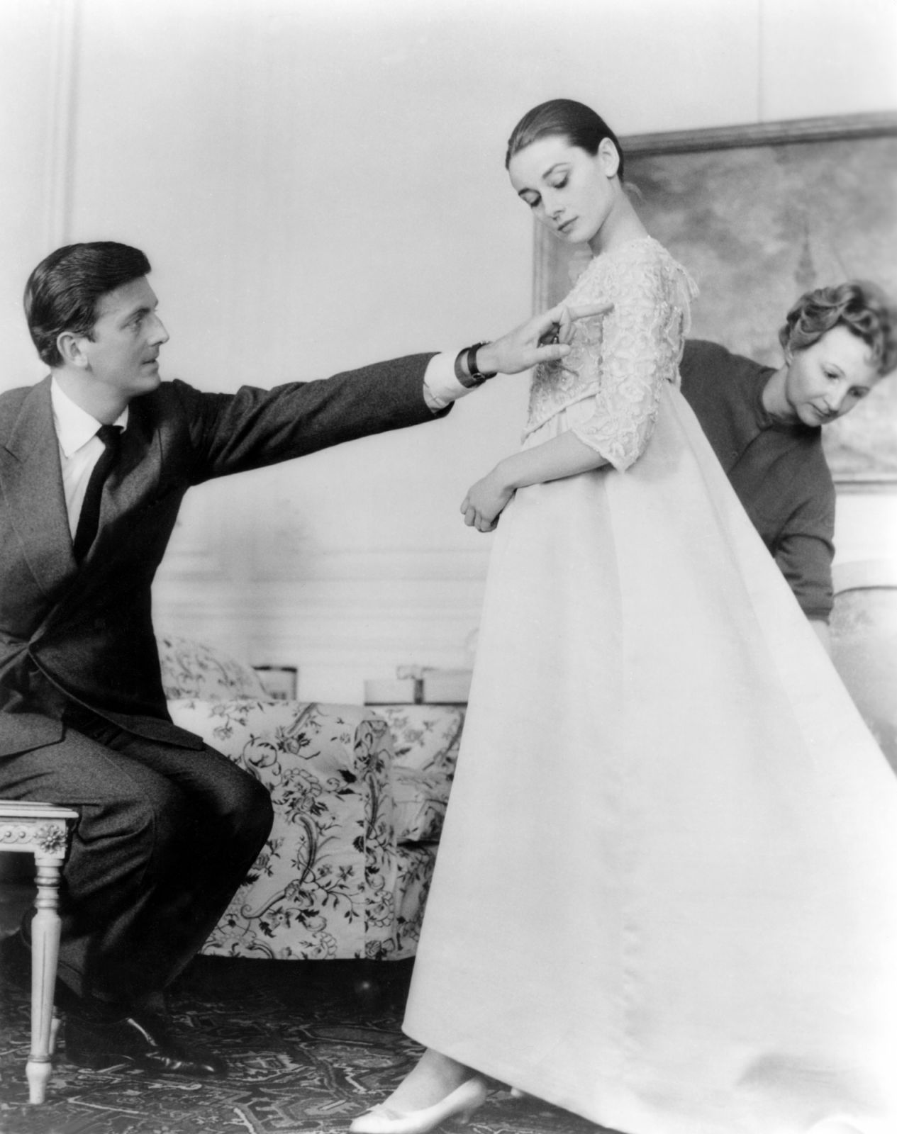British actress Audrey Hepburn with French fashion designer Hubert de Givenchy in his workshop, in Paris. (Photo by Sunset Boulevard/Corbis via Getty Images)