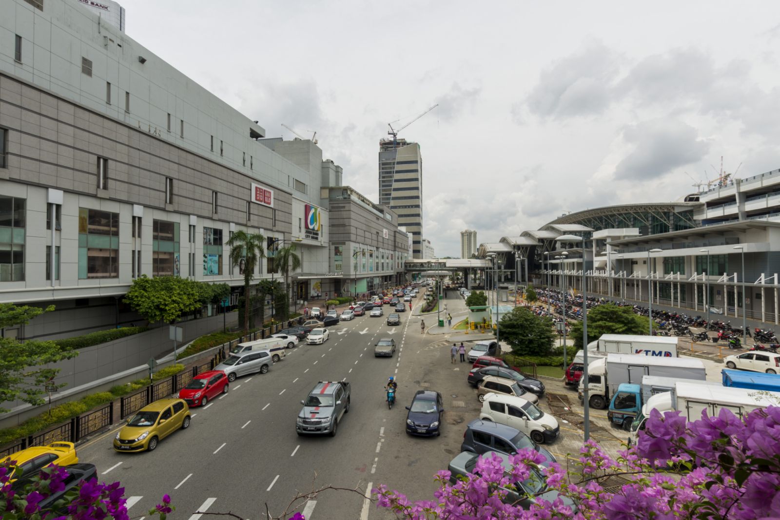 Johor Bahru, Malaysia - October 30, 2016: Traffic and pedestrians on the street in Johor Bahru, Malaysia.
