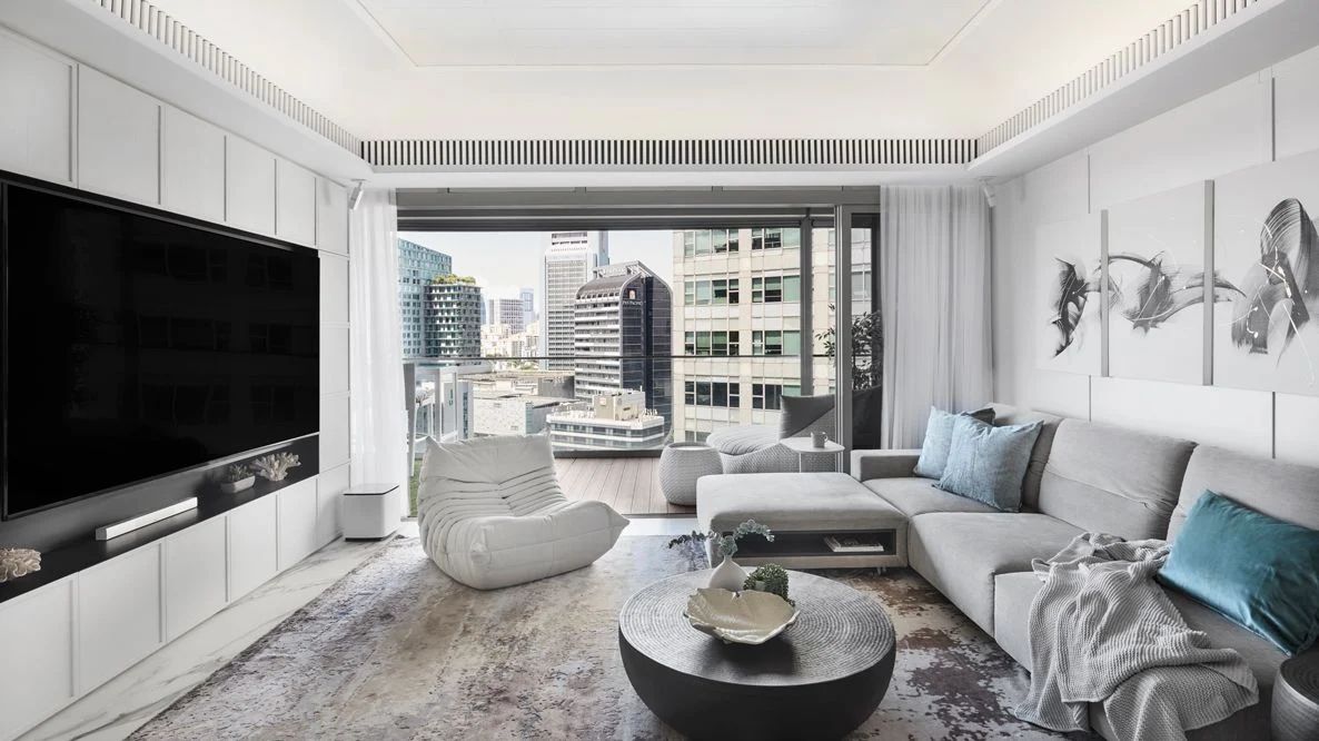 The apartment’s living room opens up to wonderful views of the glitzy Orchard Road shopping district