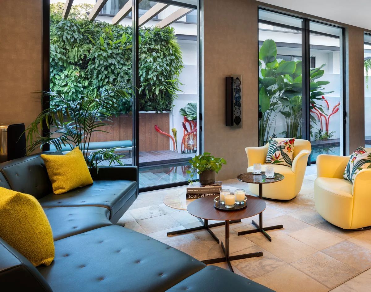The living room looks out to a lush vertical garden which also acts as a privacy screen