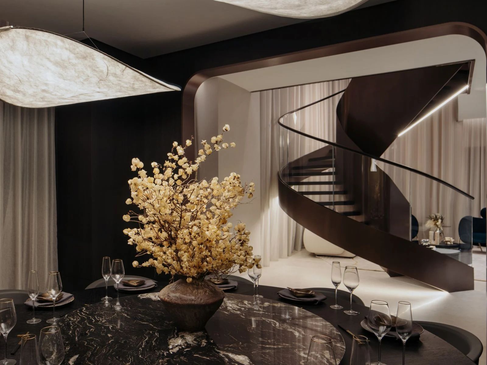 An elegant spiral staircase twists and connect various sections of the expansive 6,000 sq ft super penthouse