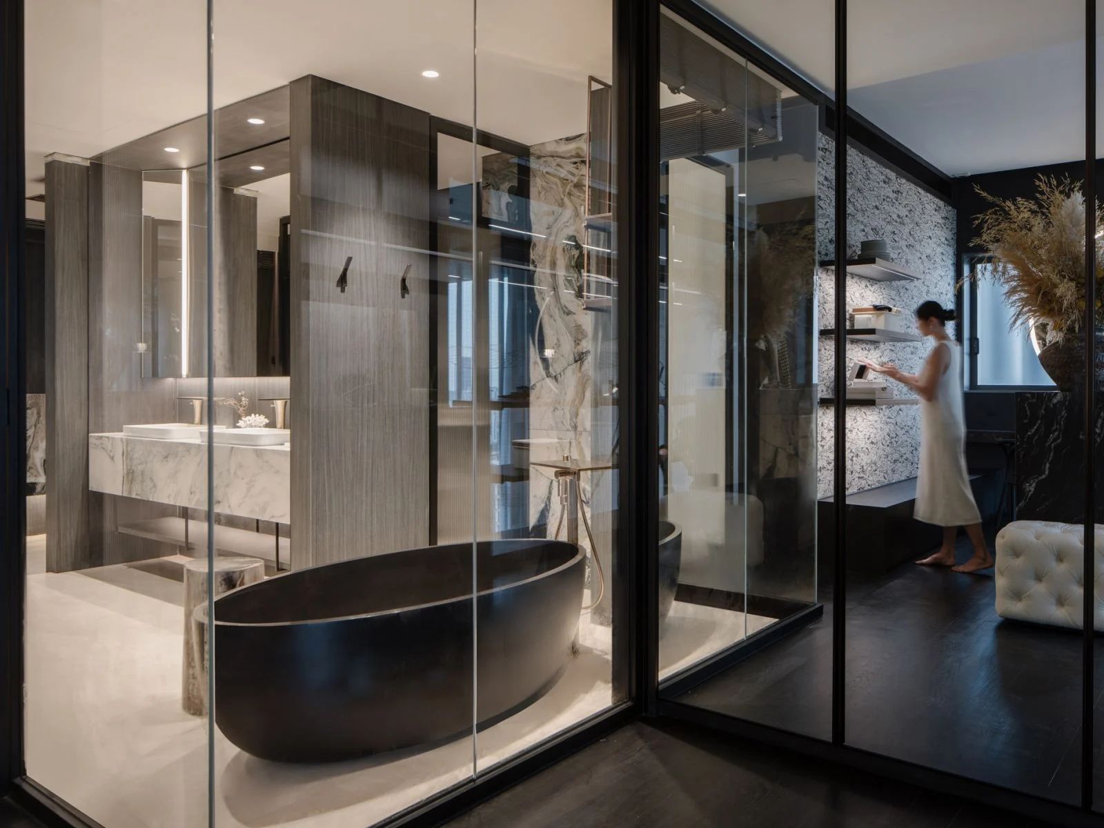 The master bathroom features a freestanding black bathtub