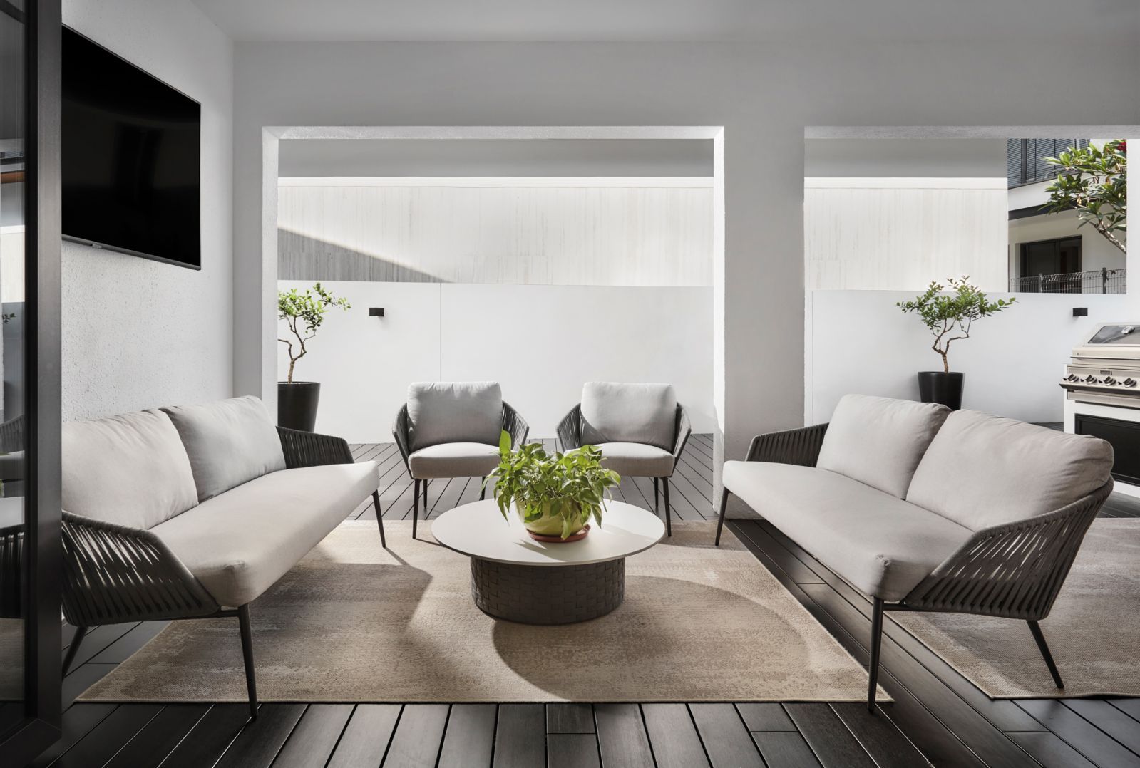 The breakfast and barbecue corner in the home’s inviting backyard