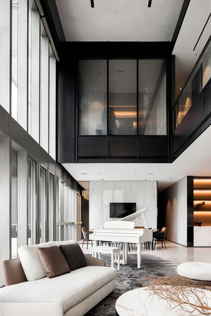 The carpet’s organic shape can be appreciated as one looks down from the study and second level walkway
