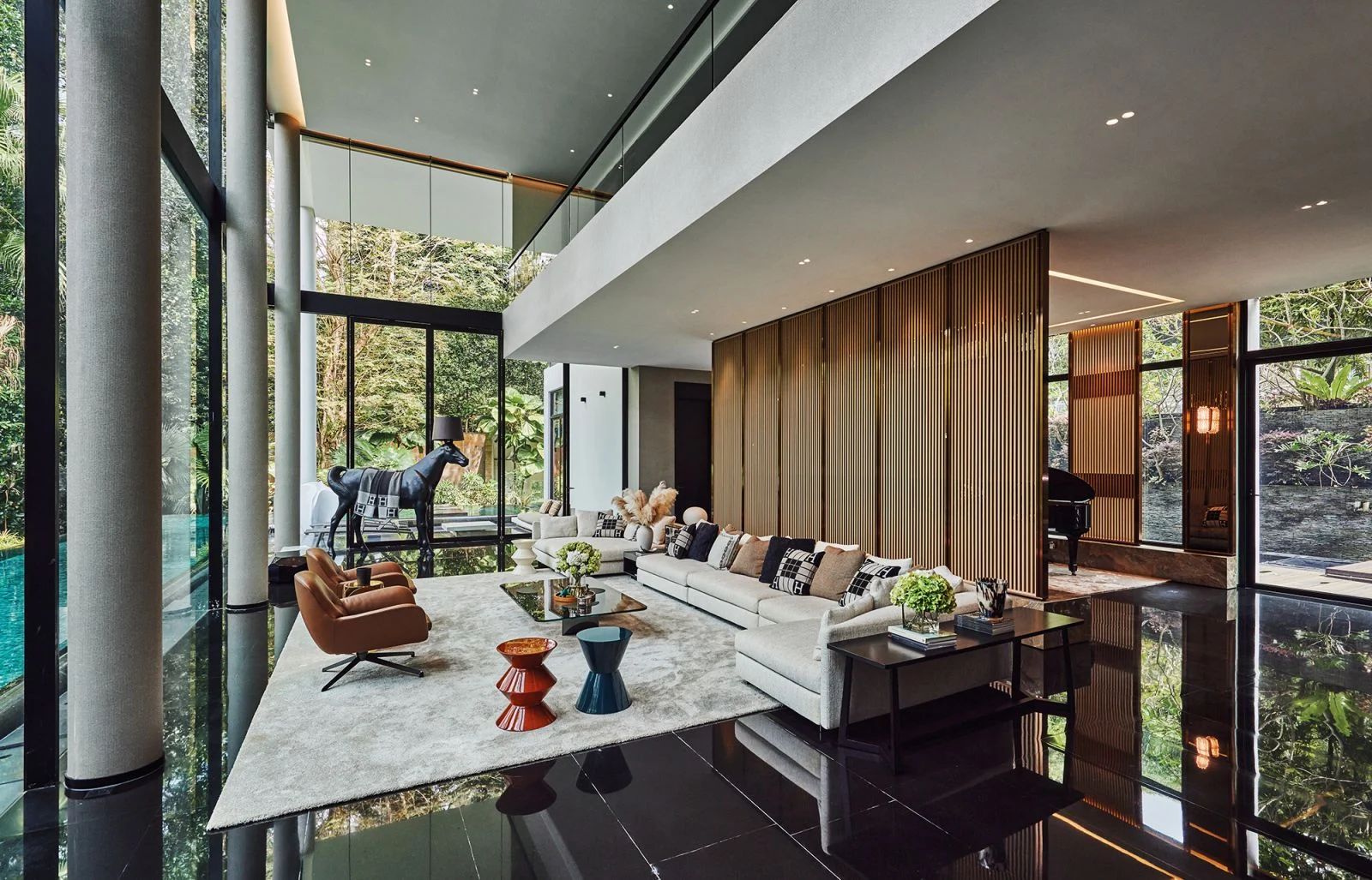 An elegant bespoke divider carves out two distinct zones on the ground floor