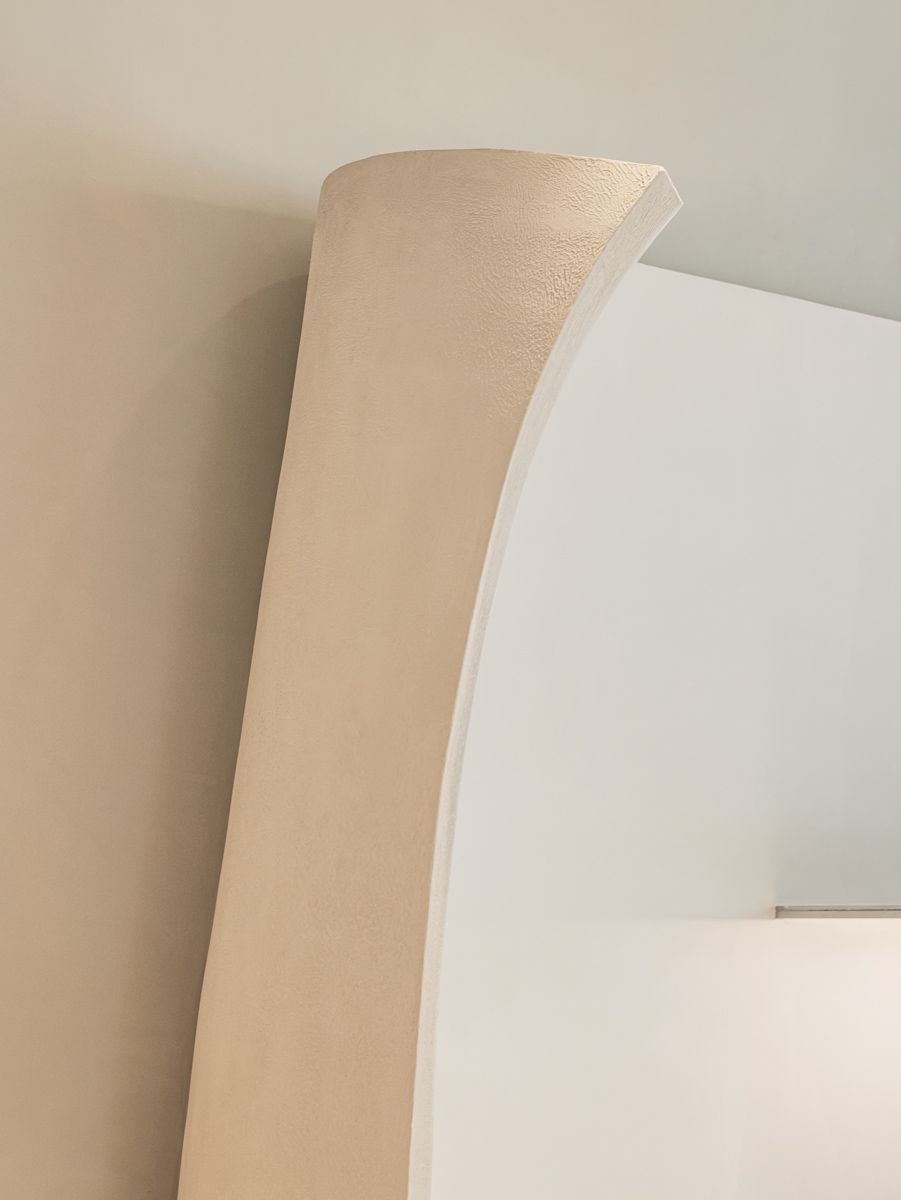 A close-up detail of the delicately curving interior wall