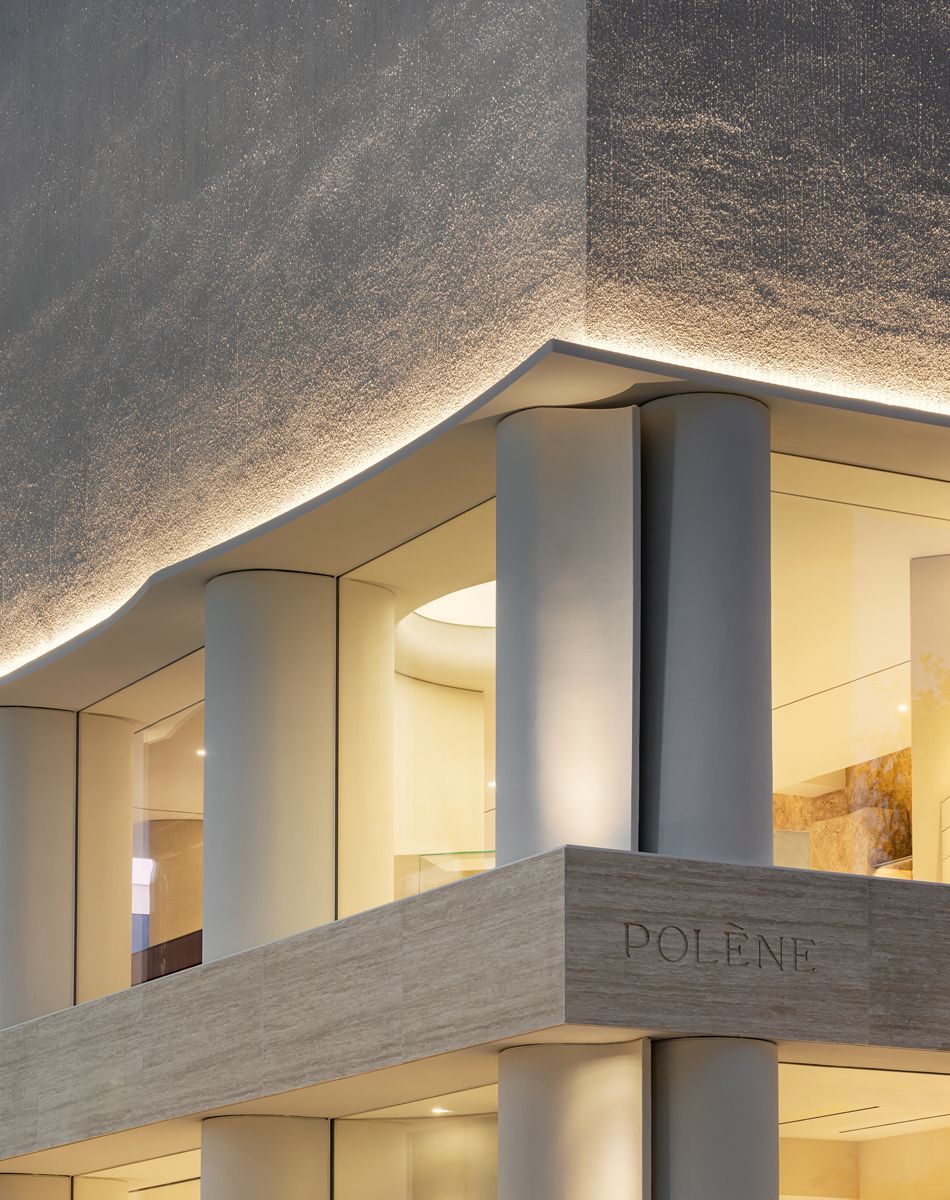 Soft lighting highlights the subtle textures of the facade