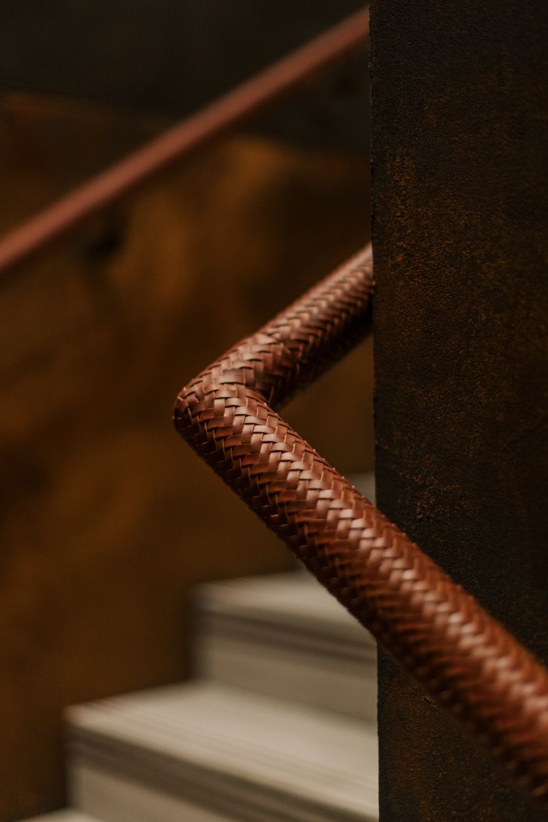 The woven leather banisters made by Alma Studio, a historic British workshop specialising in leather-based furnishings
