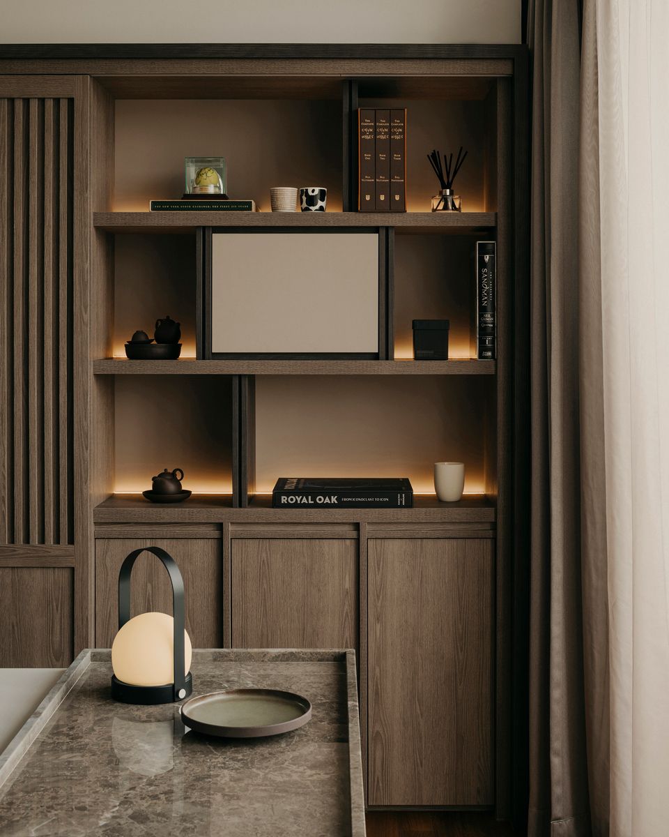An artfully curated display wall near the kitchen