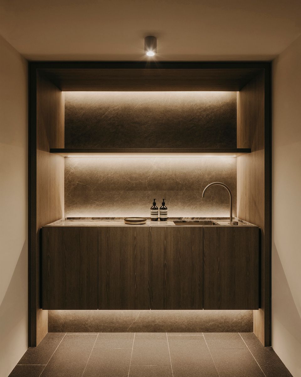 Subtle lighting highlights the fine surface texture of the sink area