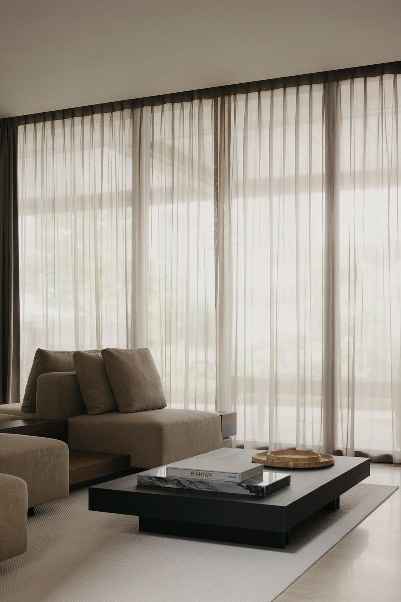 The living room sofa serves as an island of comfort in the living area
