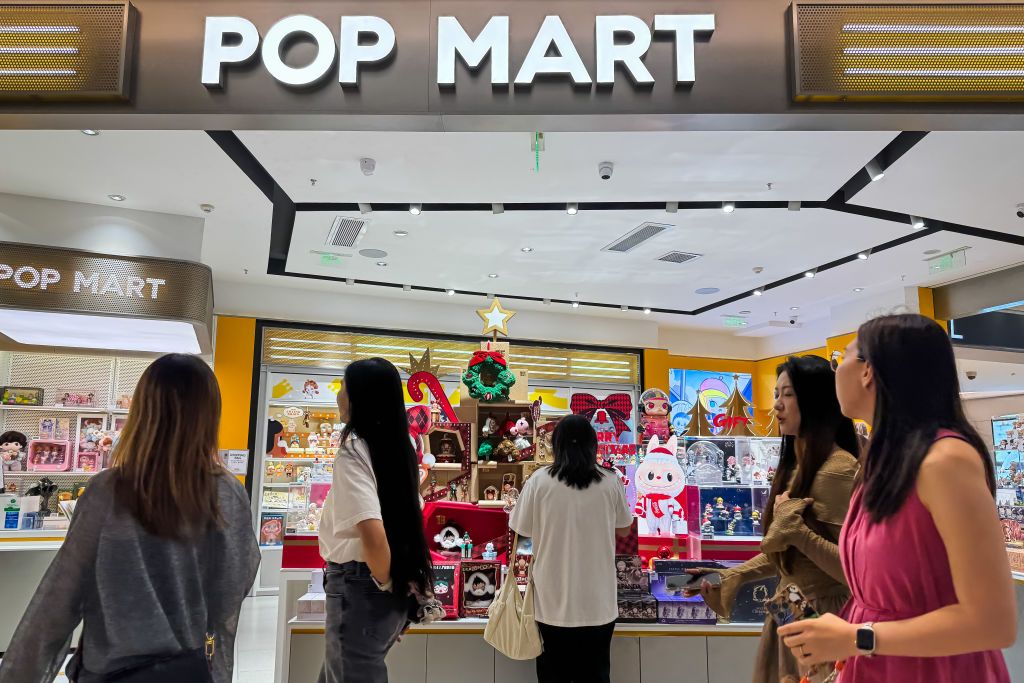 SHENZHEN, CHINA - NOVEMBER 17: Customers browse collectible toys and figurines at a POP MART store on November 17, 2024 in Shenzhen, Guangdong Province, China. POP MART has gained popularity among young consumers in China with its trendy blind-box toys and limited-edition collectibles. (Photo by Cheng Xin/Getty Images)