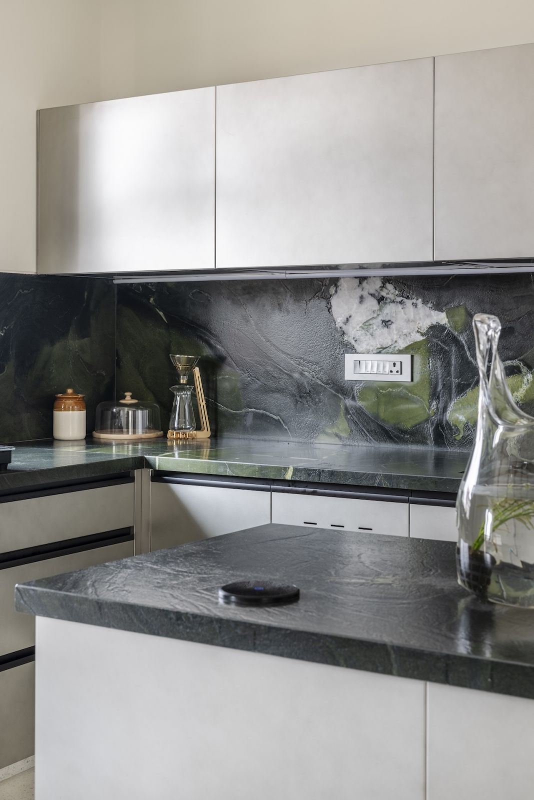 The kitchen with a distinctive marble backsplash in a Mumbai, India family home (Photo: Prashant Bhatt)