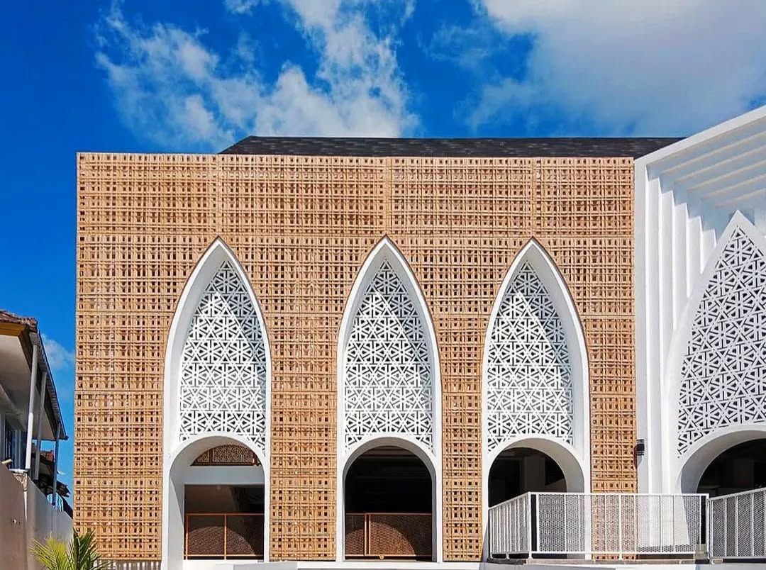 The façade incorporates synthetic rattan wickerwork and stylised Sasak weaving motifs (Photo: Instagram / @andyrahman.architect)