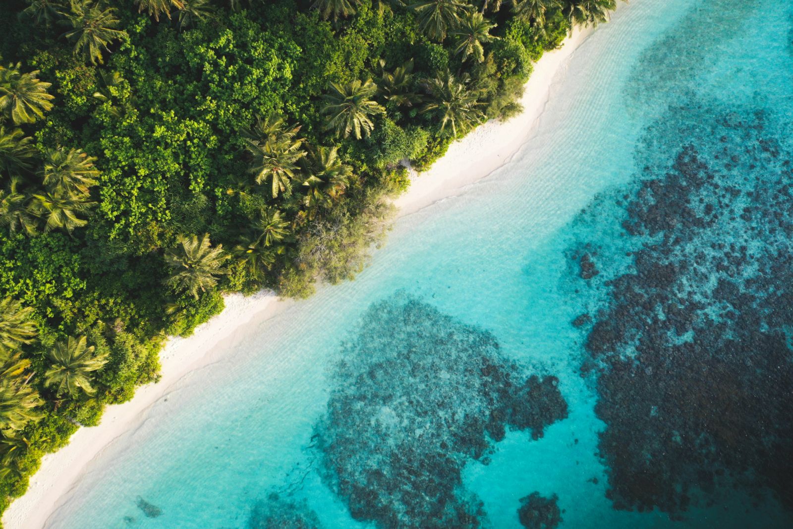 Dhigurah Island offers a more authentic Maldivian experience. (Photo by Hoodh Ahmed on Unsplash)