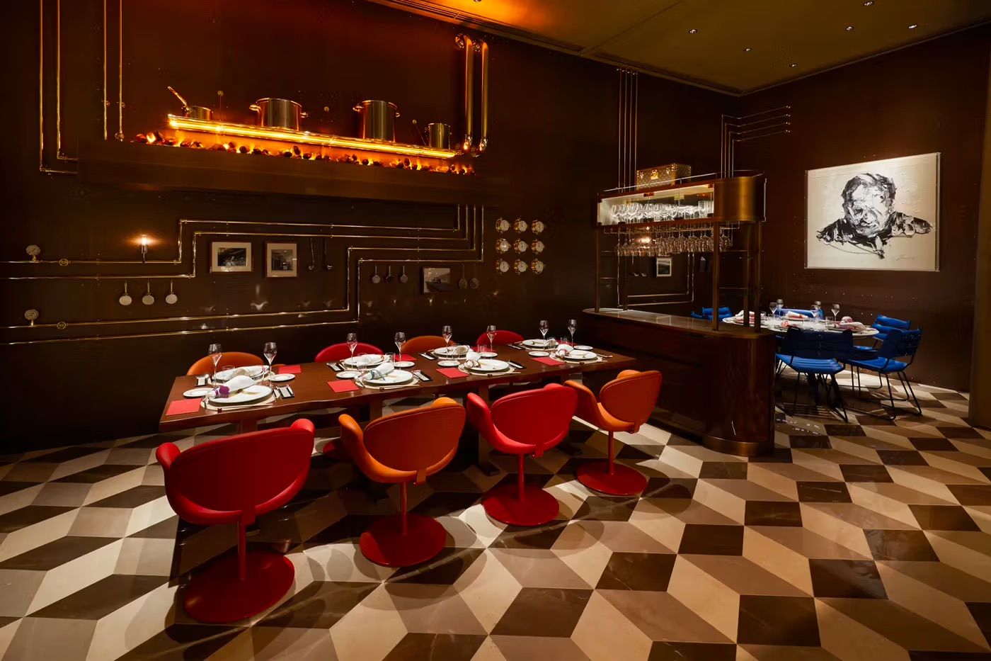 The more formal Sugalabo V restaurant, connected to Le Café V, presents a dramatic interior with detailing reminiscent of a trunk’s hardware (Photo: Louis Vuitton)
