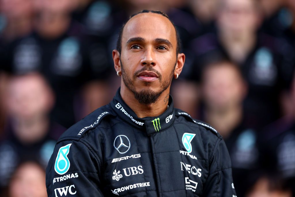ABU DHABI, UNITED ARAB EMIRATES - NOVEMBER 23: Lewis Hamilton of Great Britain and Mercedes looks on at the Mercedes GP Team Photo during previews ahead of the F1 Grand Prix of Abu Dhabi at Yas Marina Circuit on November 23, 2023 in Abu Dhabi, United Arab Emirates. (Photo by Clive Rose/Getty Images)