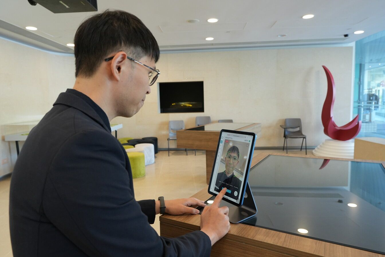 Chin scans his face using an iPad equipped with the company’s technology (Photo: HKUST)
