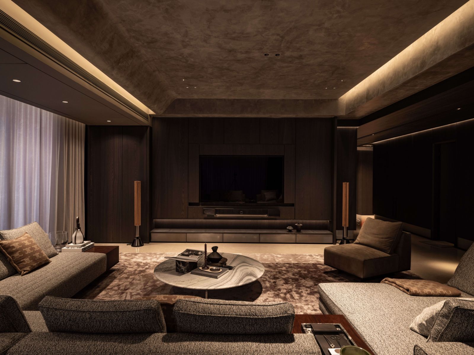 The living room reveals the spatial narrative with the Minotti Roger Set sofa anchoring the composition