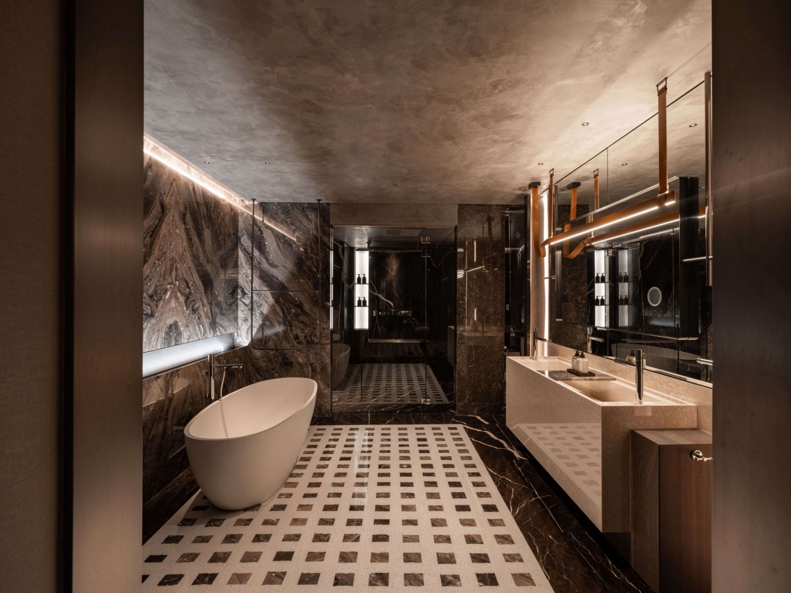 The master bathroom balances openness and intimacy