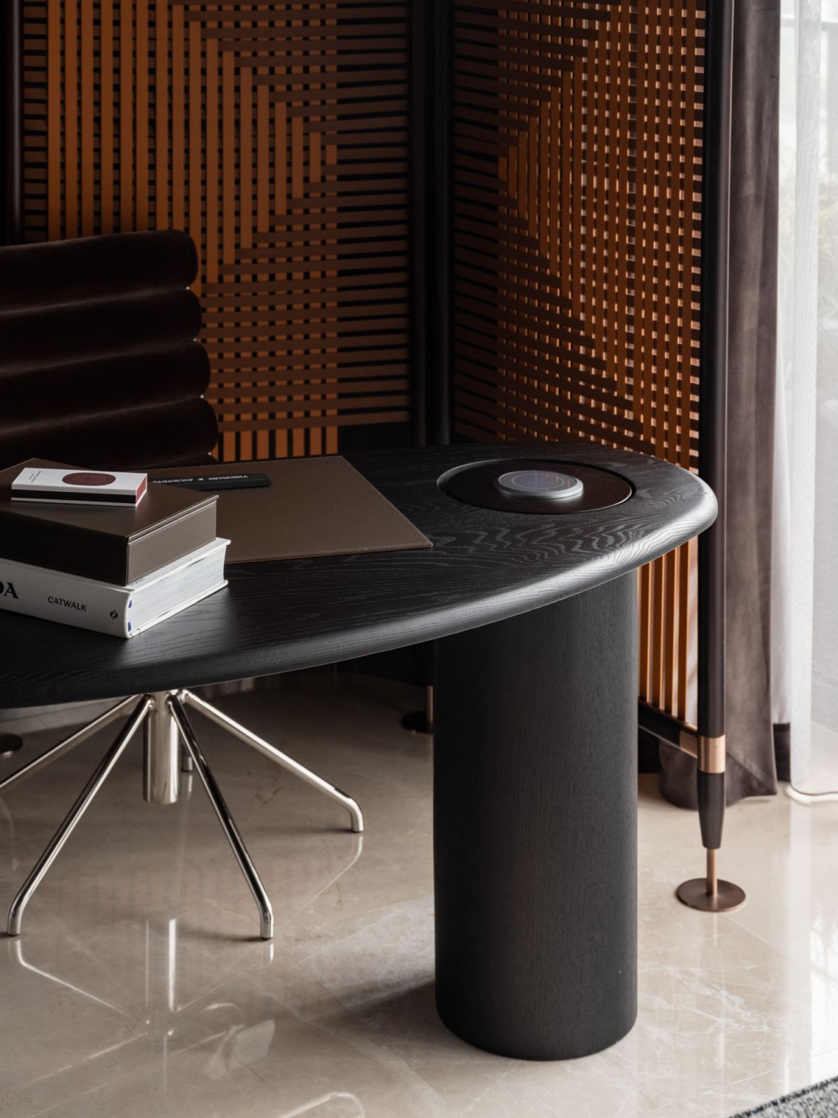 A thoughtfully positioned desk creates a functional workspace with views of the coastline