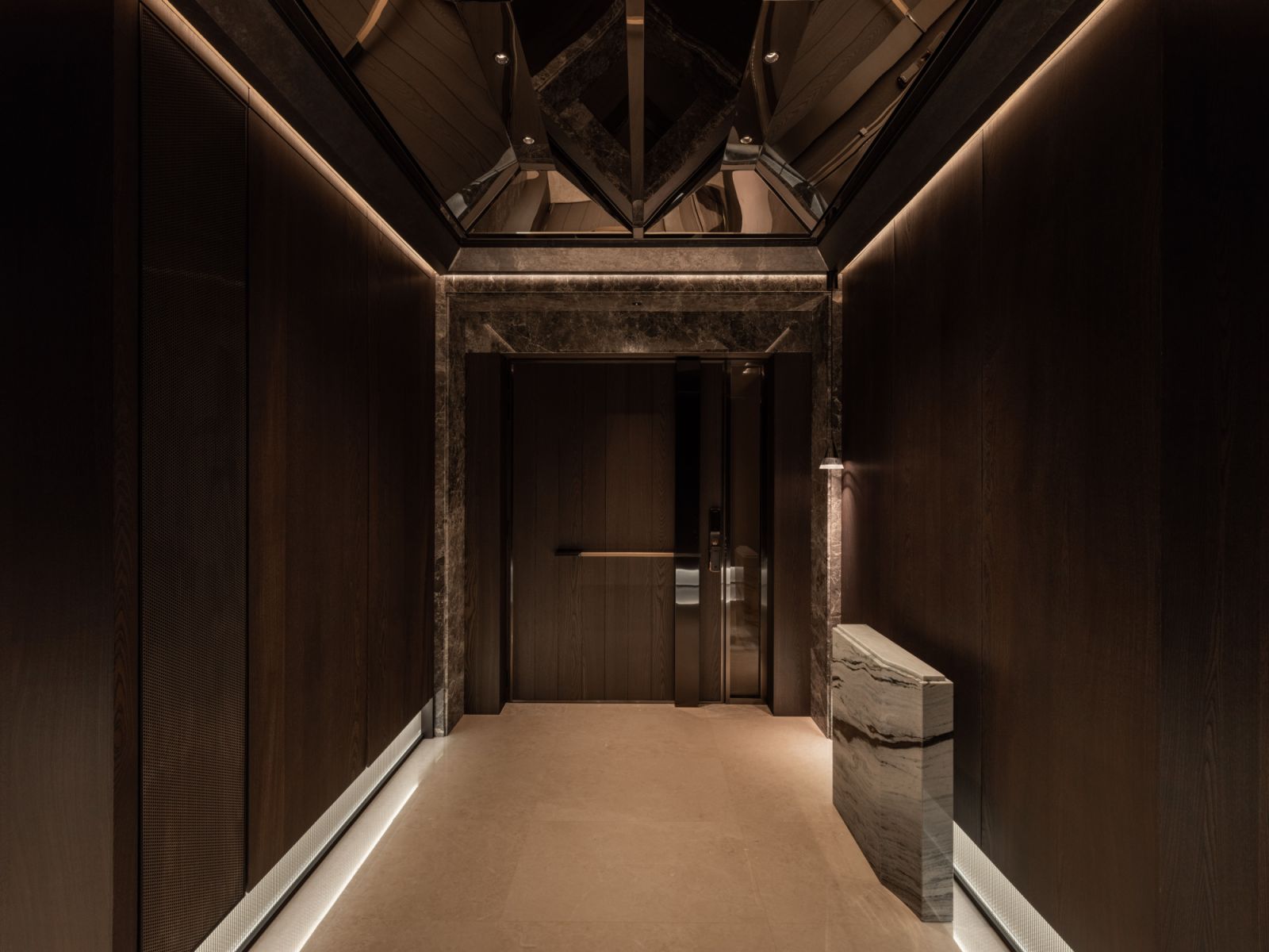 The private lift lobby features understated finishes that transition smoothly into the overall design scheme