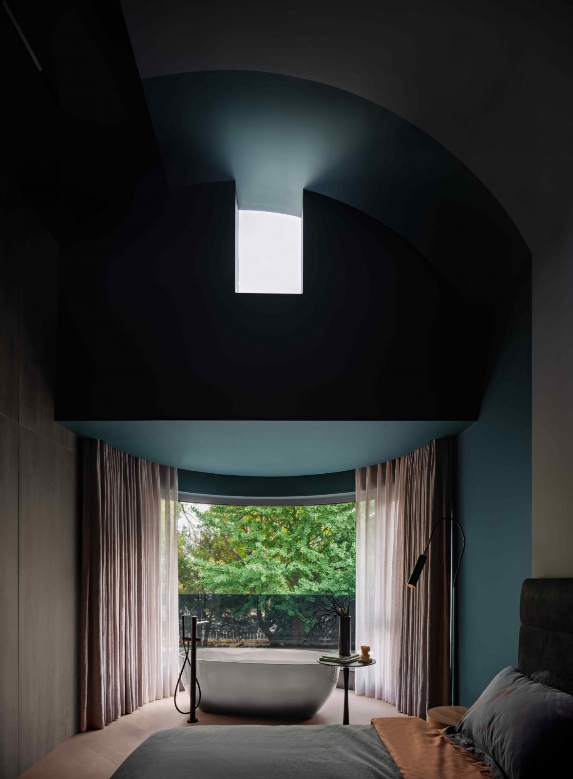 A square of daylight peeks through this structural cut-out