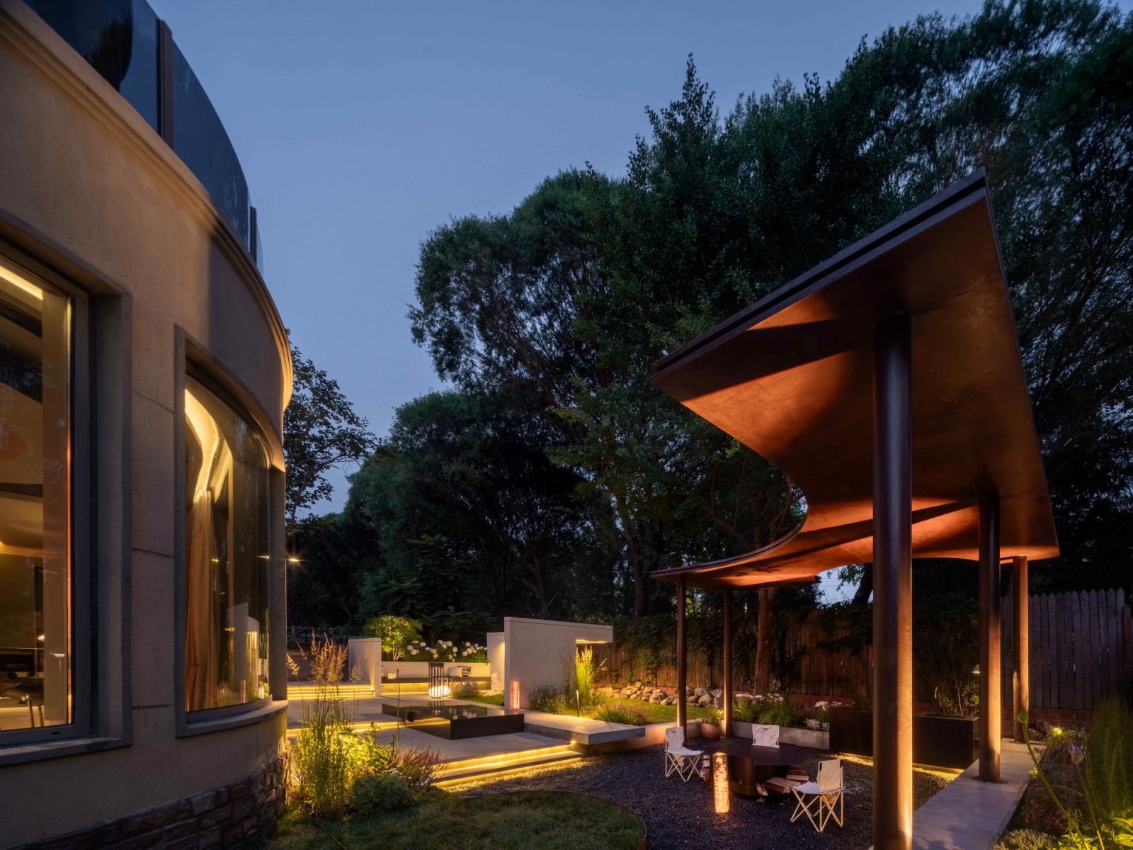 A blend of lush landscaping and architectural touches characterises the expansive rear garden