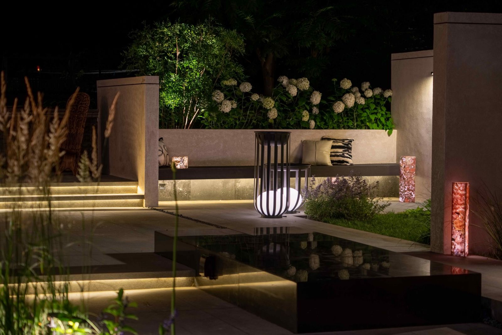 A minimalist black water feature adds contemporary touches