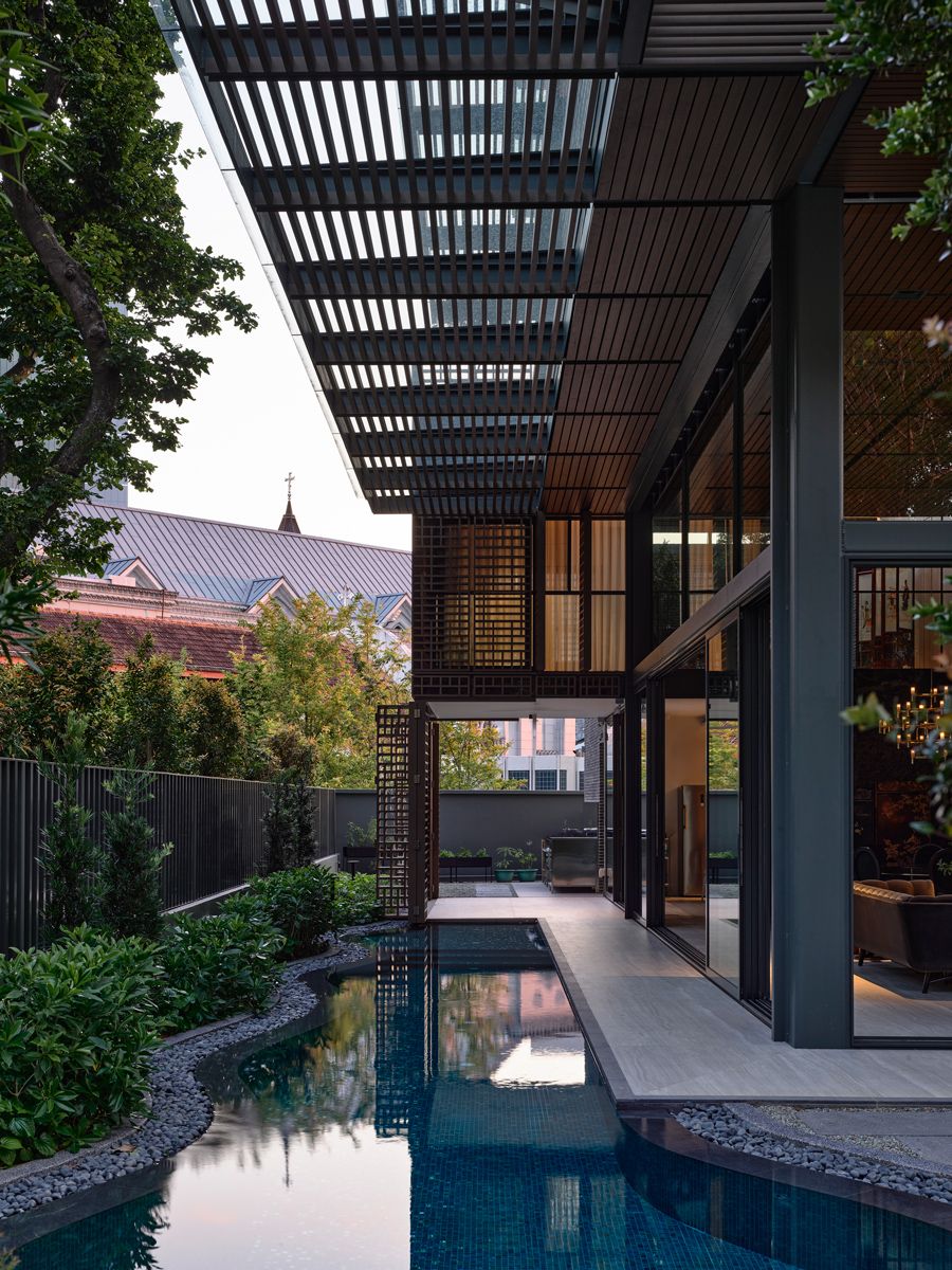 Adjacent to the kitchen's outdoor area is a garden of herbs