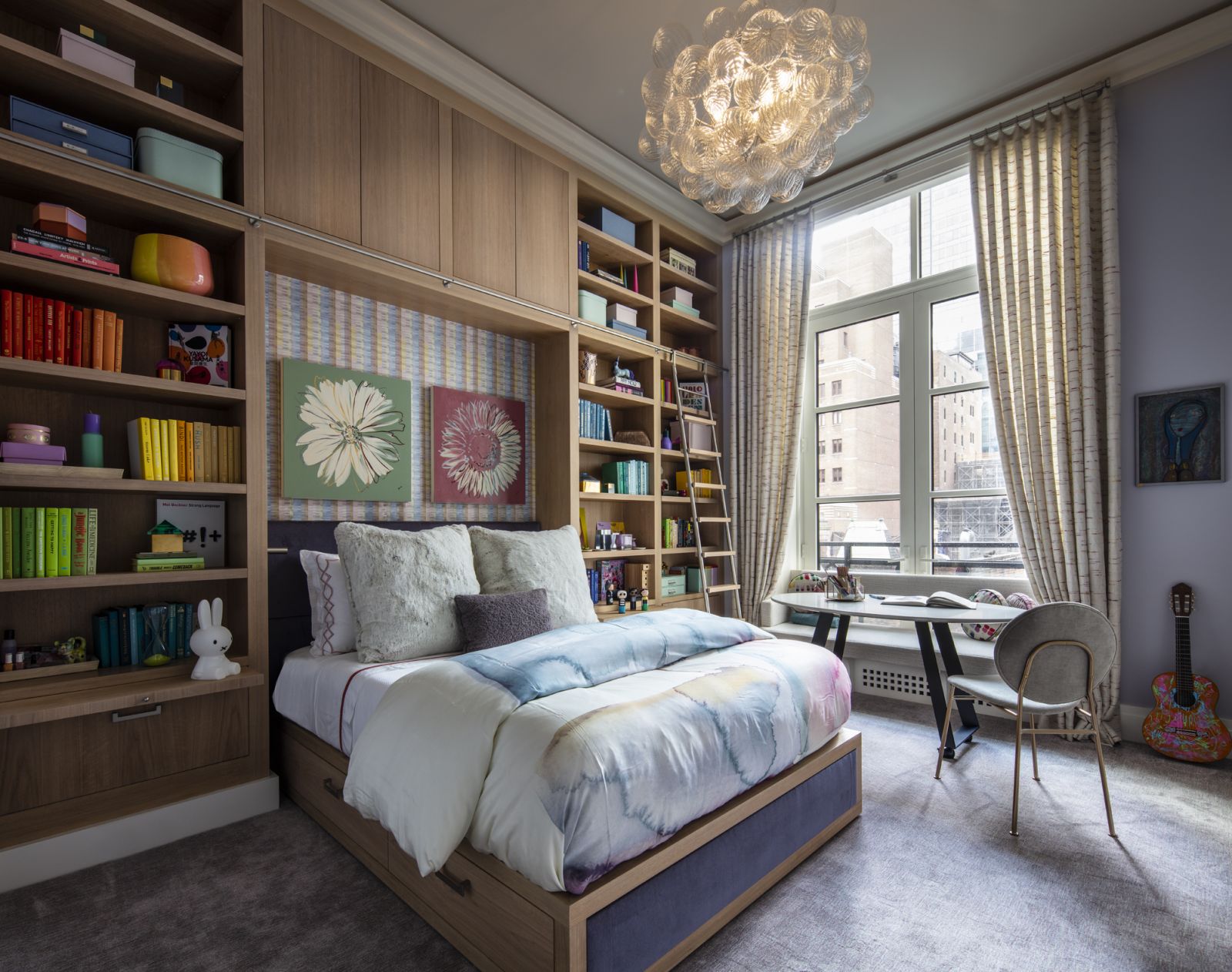 One of the bedrooms in a Central Park, New York family home with a chandelier by Julie Neill via Circa Lighting and a bed custom designed by ADforJJ in a Central Park, New York family home