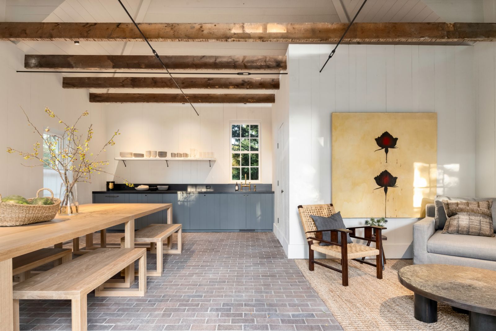 The open-plan living and dining space in the converted pool house
