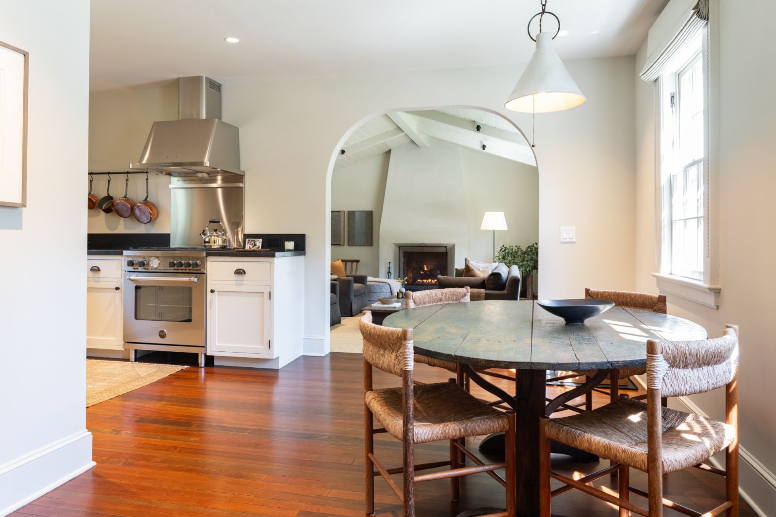 A seamless flow through the archway from the kitchen and dining area into the living room
