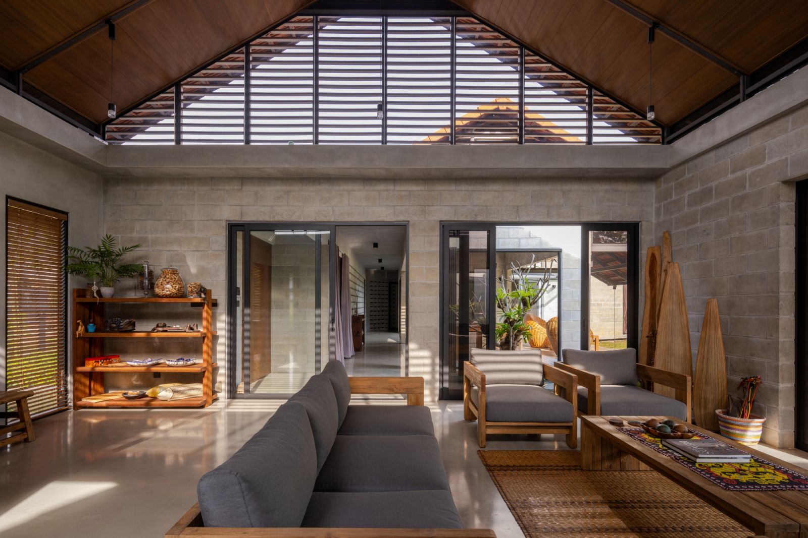 The main living area showcases the gabled roof design with ventilated eaves at the apex, allowing hot air to escape