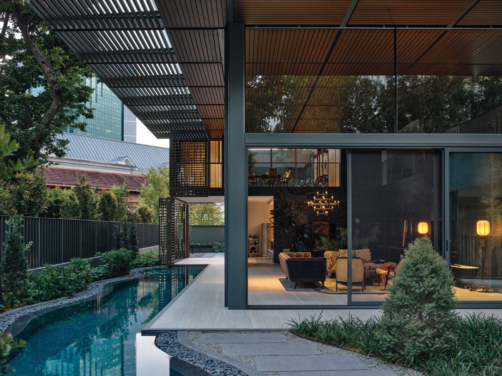 Vernacular materials evoke the look and feel of a traditional Chinese courtyard house, providing a fitting backdrop to the carefully curated furniture and the owners’ extensive collection of cultural and religious antiques