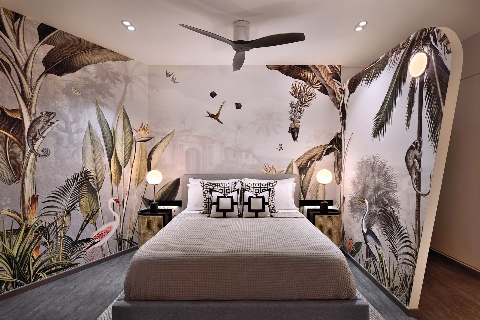 The black blades of the fan in this gorgeous bedroom are played up by the dark highlights on the wallpaper and furniture