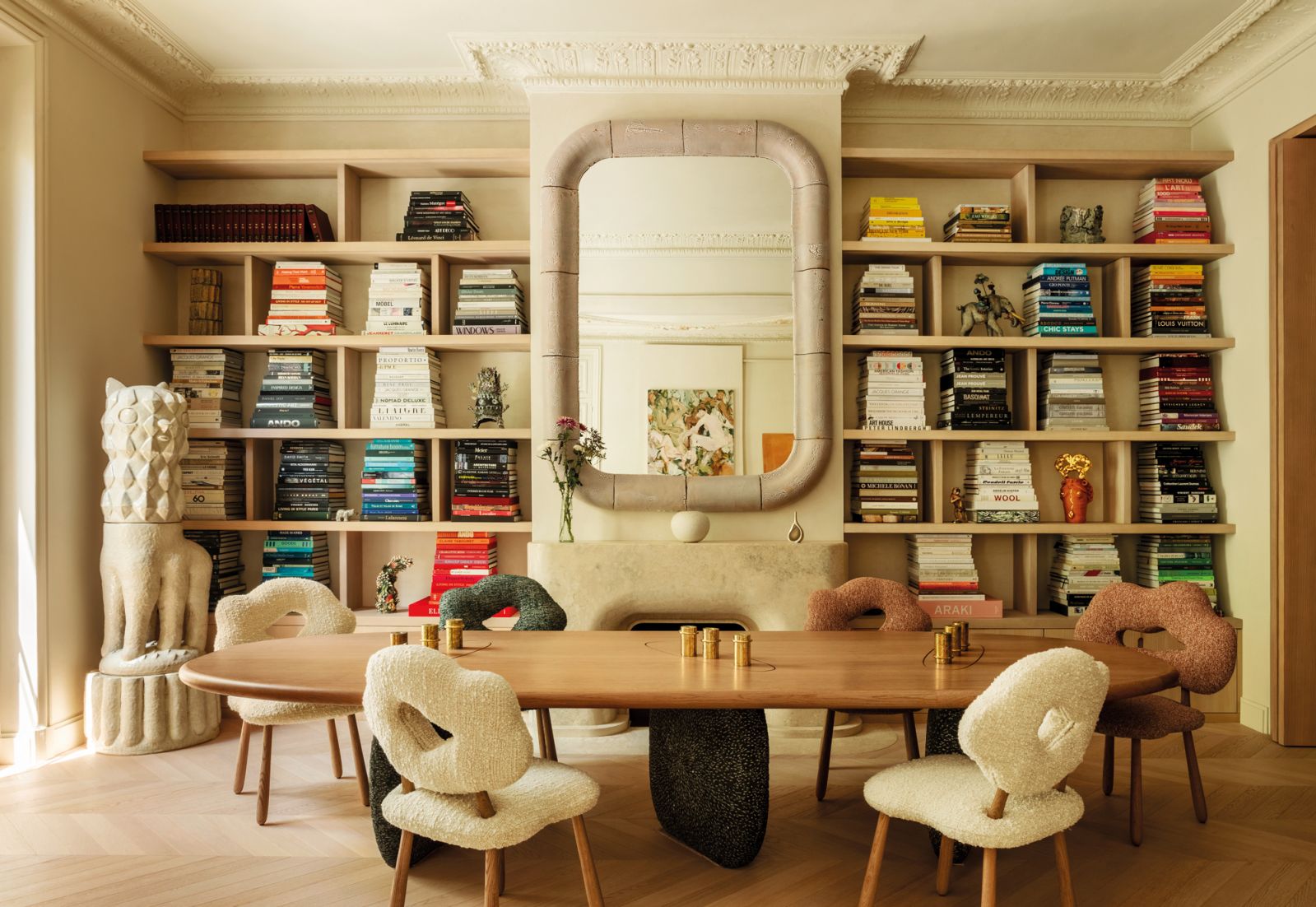 Laurent Dufour’s glazed porcelain llama sculpture stands in the dining area next to her other statement furnishings