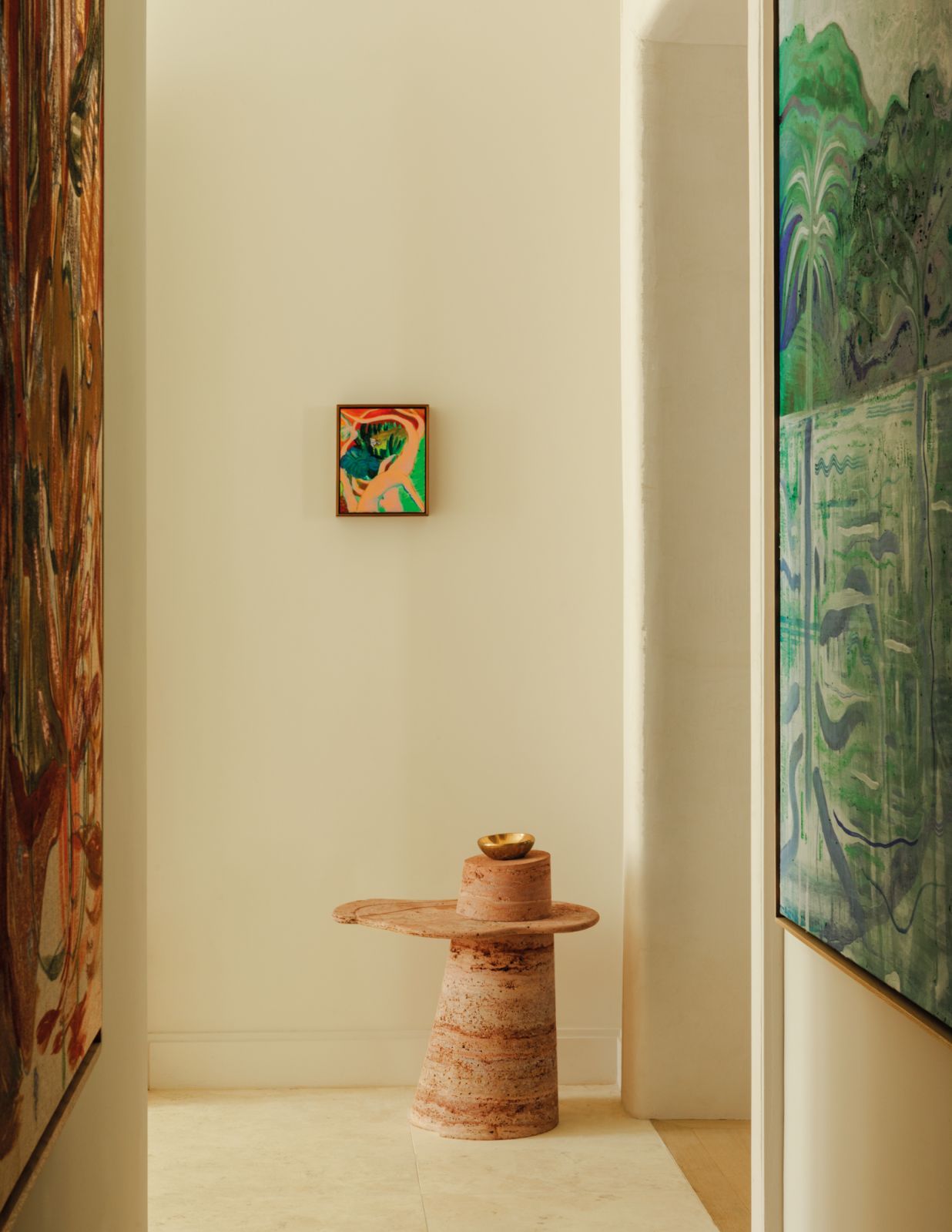 Paint with a textural finish and conspicuous brushstrokes adds depth to the off-white walls