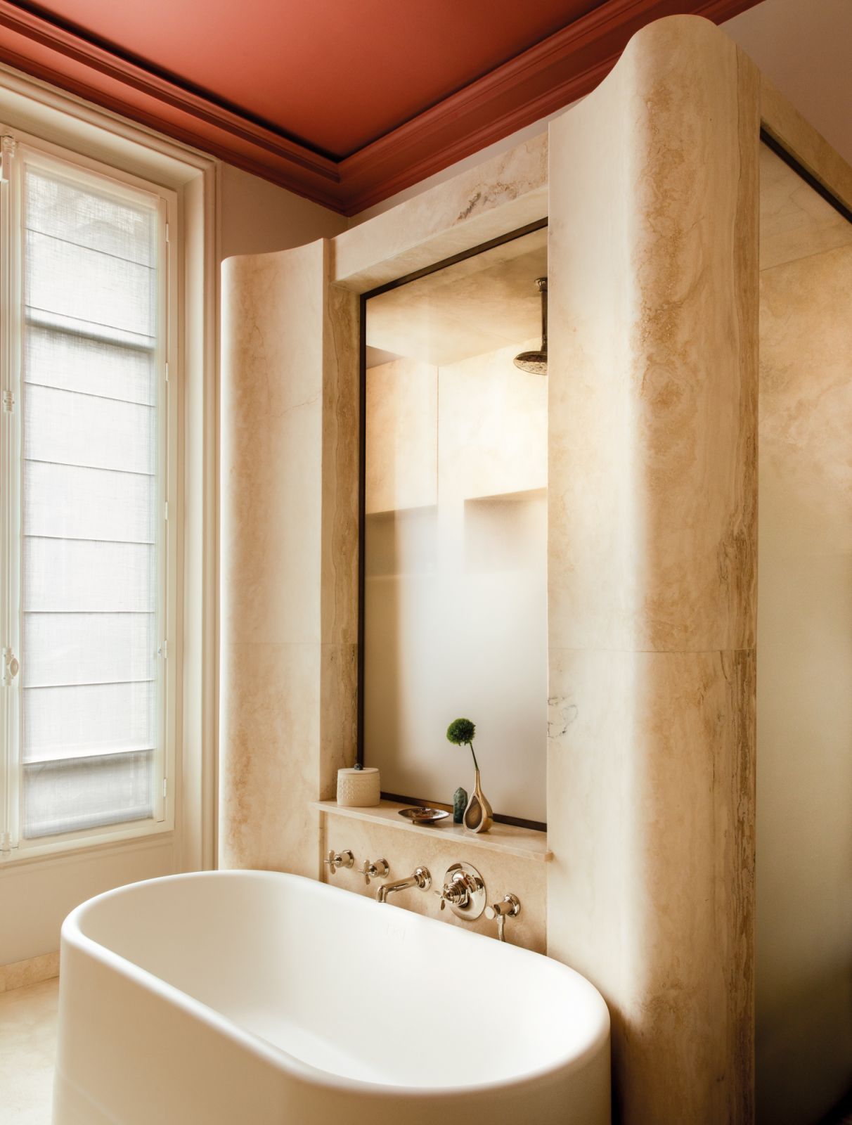 The master bathroom sports a majestic look with the use of carved white onyx