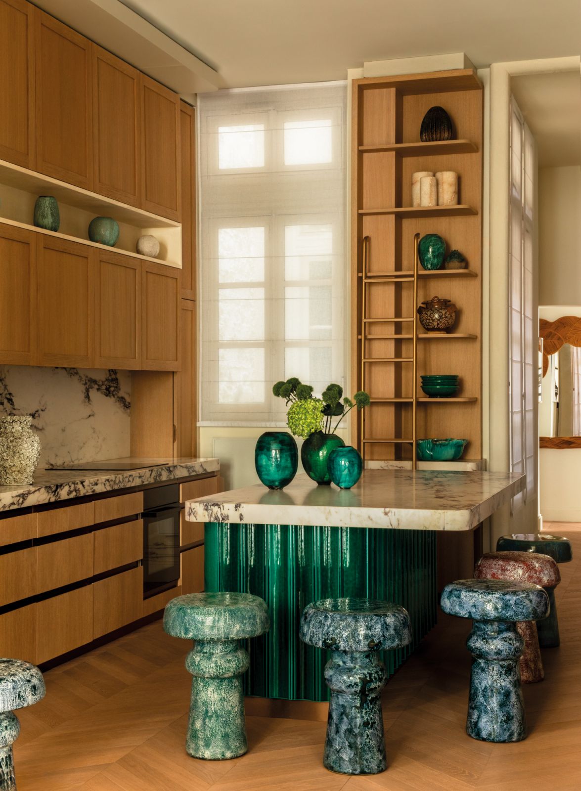 Inspired by feng shui for balance and harmony, accents of green are used in the kitchen to bring a grounding energy and tranquillity to the space