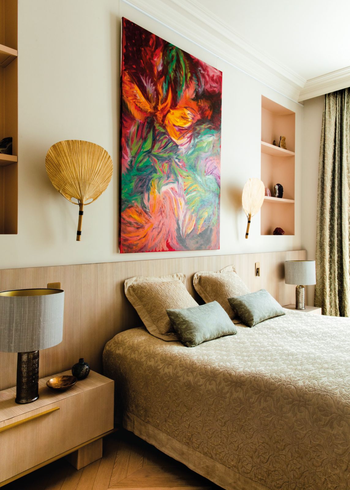 A vibrant, dramatic artwork  injects movement and life into this otherwise placid bedroom