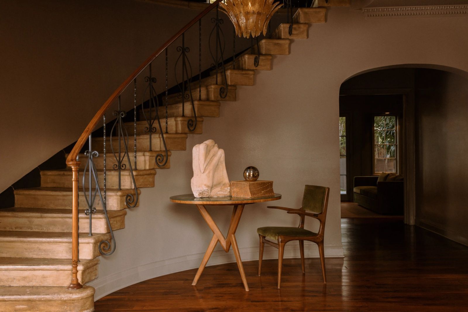 The staircase with marble steps and Art Deco balustrade railings, designed by Tiffany Howell of Night Palm (Photo: Pablo Enriquez)